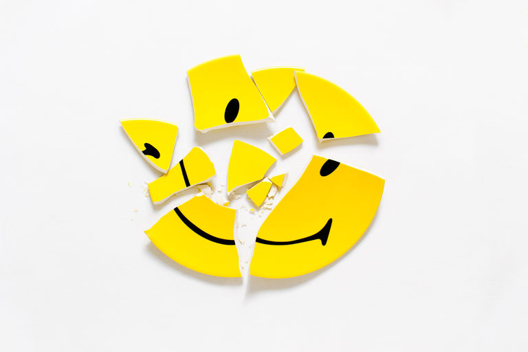 an uncropped broken smiley-face plate