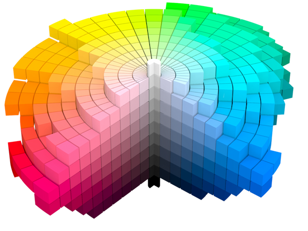 A colorful, modern, and clean 3D visualization. It consists of a bunch of stacked rings made of little cubic wedges, each with a solid color. It almost looks like voxel art. All together they make an rough, irregular, lopsided shape that starts at a single small black cylinder at the bottom, grows out to a huge colorful pinwheel of colors, and shrinks back to a single small white cylinder white at the top. A quarter of the solid has been cleanly cut away to the core, letting us see two planes of squares - all with constant hue but varying lightness and chroma. The core is achromatic and goes from black through gray up to white. Each step away from it gets more and more chromatic. The furthest tips on each cutaway plane are the most chromatic. The left plane of the cutaway has a magenta hue and the right, blue. The rest of the stacked rings are colored like the rainbow: orange, yellow, green, and cyan. Presumably missing, in the cutaway section, are red and purple.