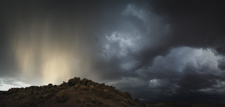 wandering columns of rain all aglow