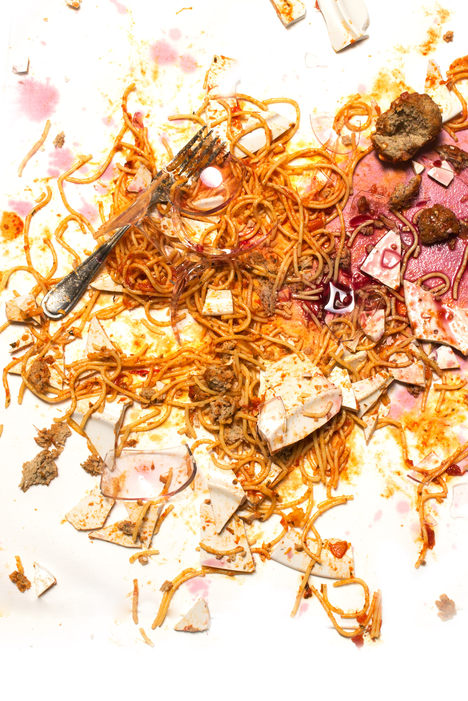 an extremely smashed plate full of pasta and meatballs (and wine)