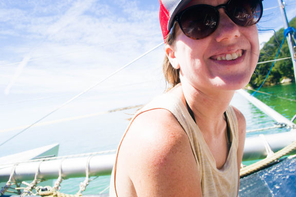 Britt, smiling, on a boat.