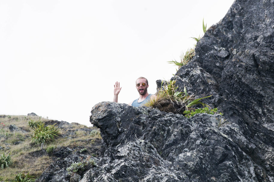 Sam peeping/waving from behind a rock.